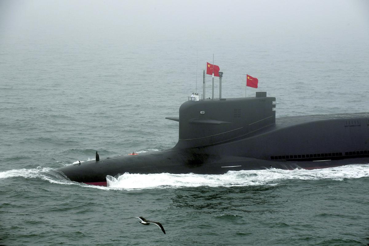 A new type of nuclear submarine of the Chinese People's Liberation Army (PLA) Navy is reviewed during a naval parade