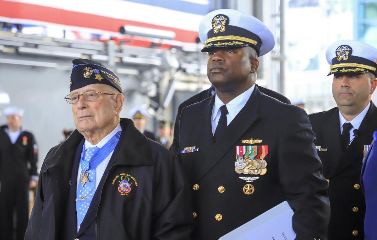 The USS Hershel “Woody” Williams (ESB-4) bears the name of the last surviving Medal of Honor recipient from the Battle of Iwo Jima. Chief Warrant Officer Williams is shown at the commissioning with Commander Samuel Hoard Jr., the ship’s officer-in-charge, gold crew, at the public ceremony in March.