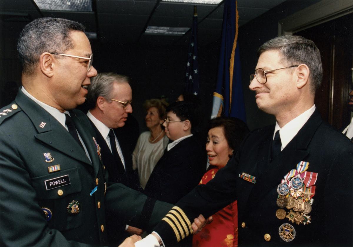 Chairman of the Joint Chiefs General Colin Powell greets Captain Swartz at his retirement ceremony in 1993