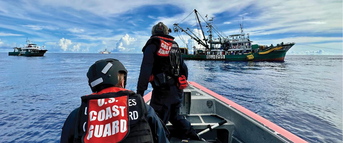 Crew members from the USCGC Oliver Henry (WPC-1140) approach a fishing vessel in the Pacific Ocean in March 2023.