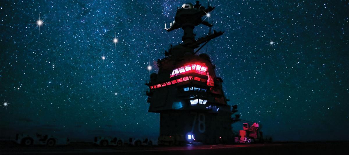 The superstructure of the USS Gerald R. Ford (CVN-78) as seen on a cloudless night in the Atlantic Ocean.