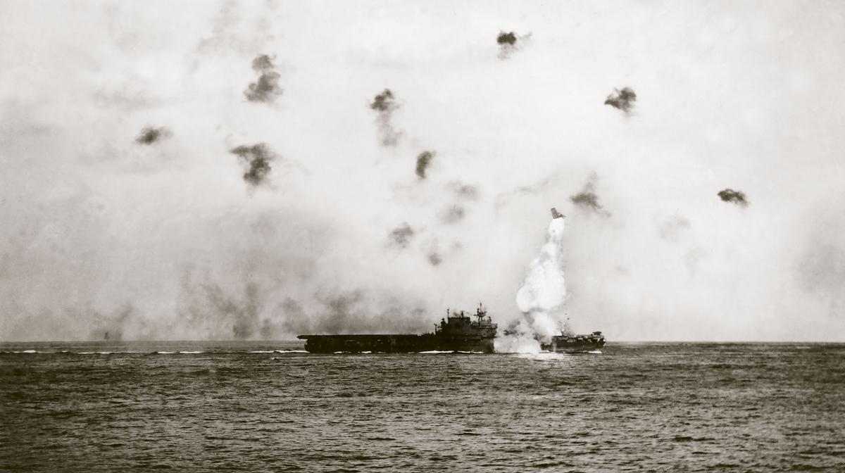 A kamikaze slams into the USS Enterprise off Okinawa.