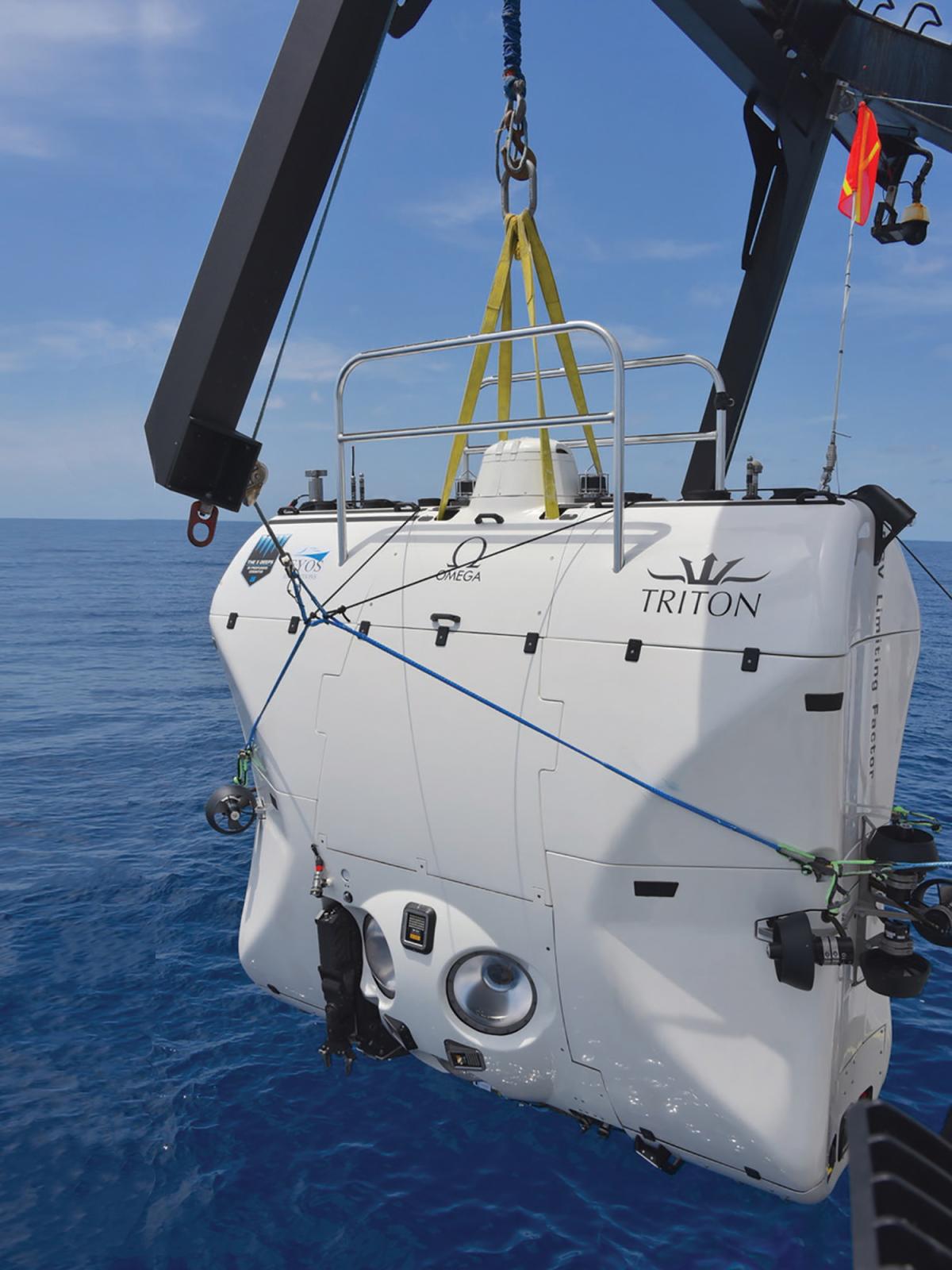 the Triton 36000/2 deep submergence vehicle hoisted above the ocean surface