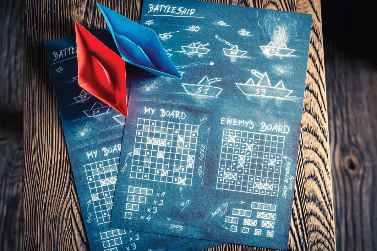 Stock image of game board with paper ships