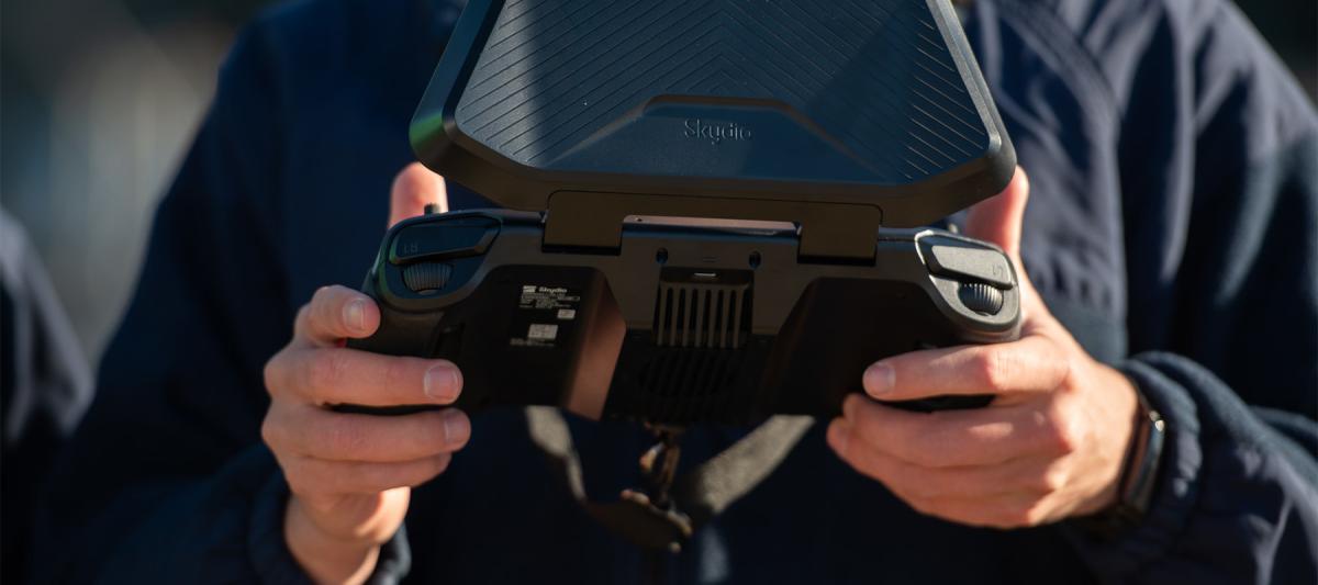 A U.S. Coast Guard member controls an unmanned aircraft system from its controller. Integrating unmanned assets into Coast Guard operations and arming the skilled workforce with state-of-the-art autonomous technology enables every cutter, small boat station, and sector to effect operations with heightened efficiency and precision. 