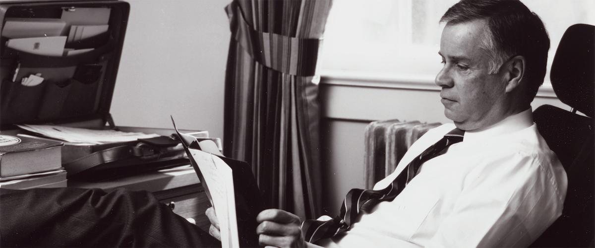 U.S. Naval Institute CEO and publisher, retired Navy Captain Jim Barber, U.S. Naval Institute CEO and publisher, sitting at his desk. Barber guided the Institute through rough seas, from which it emerged stronger than ever.