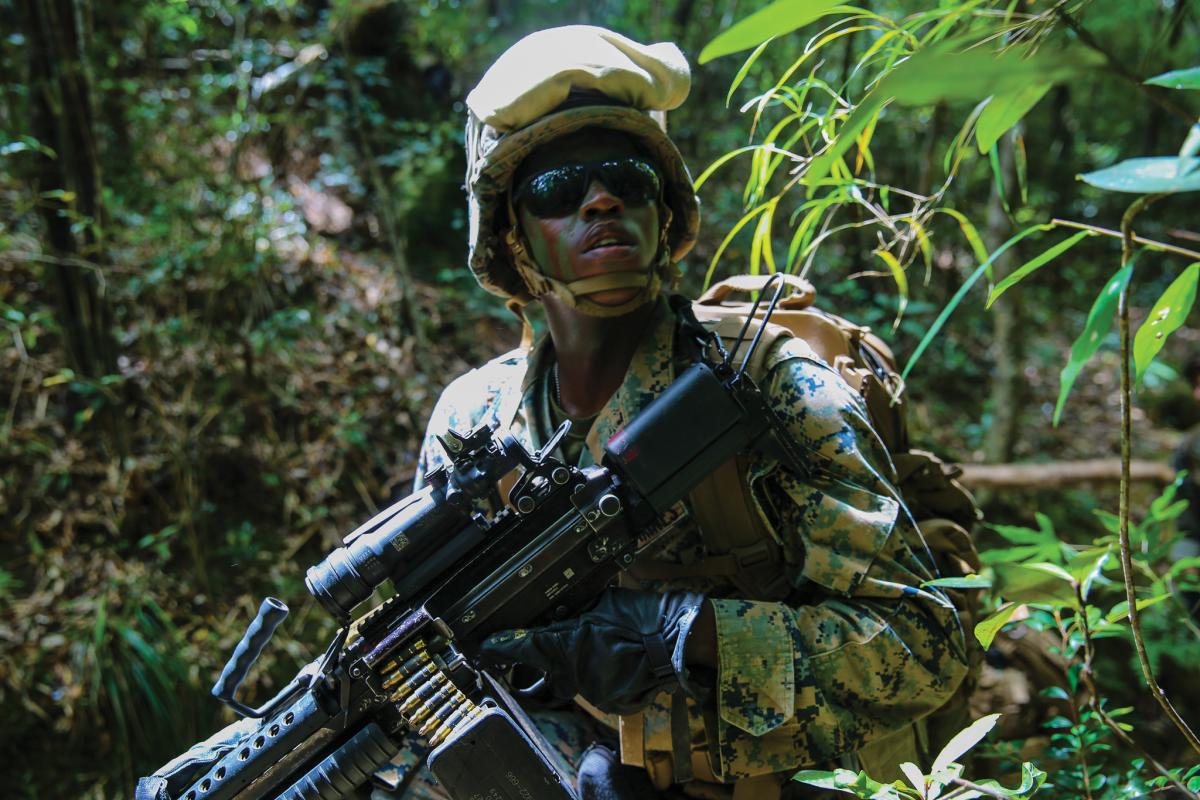 A Marine with Combat Logistics Battalion 31, 31st Marine Expeditionary Unit, provides security at the Jungle Warfare Training Center, Camp Gonsalves, Okinawa, Japan, May 22, 2018