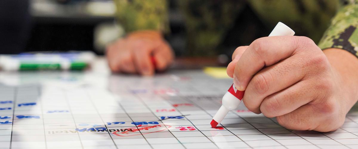 A U.S. Naval War College wargame in January 2025. Artificial intelligence would significantly improve wargame play and lessons, as it is ideally suited to solving complex optimization problems—exactly the type of problems wargaming presents.