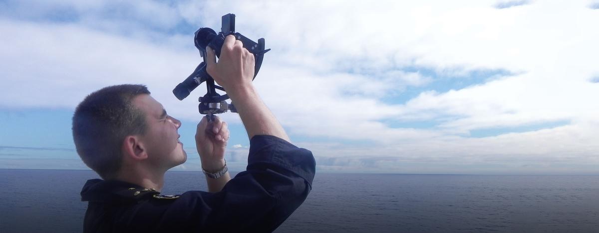 A Chilean midshipman uses a sextant to navigate on board the CNS Esmeralda