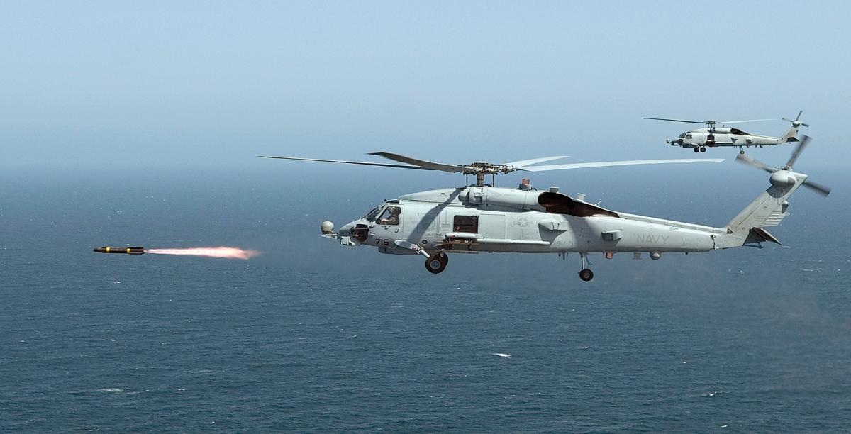 An MH-60R Seahawk assigned to Helicopter Maritime Strike Squadron 71 fires the first of four live AGM-114 Hellfire missiles. Amphibious Ready Group and Marine Expeditionary Unit leaders often do not account for the full warfighting capabilities of Helicopter Sea Combat detachments on board large-deck amphibious ships when planning operations.