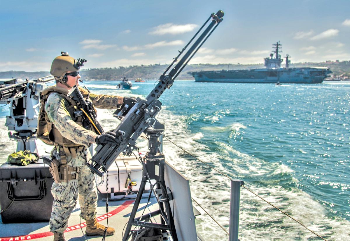 Squadron 3 mans an M2A1 .50-caliber machine gun