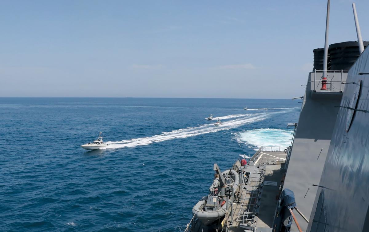 Iranian Revolutionary Guard Corps–Navy small boats harass the guided-missile destroyer USS Paul Hamilton (DDG-60) at close range in the Northern Arabian Gulf in April 2020. While deployed to the Fifth Fleet area of responsibility, Navy ships and U.S. Air Force squadrons need more opportunities to conduct joint unit-level training for air operations in maritime surface warfare to counter this threat.