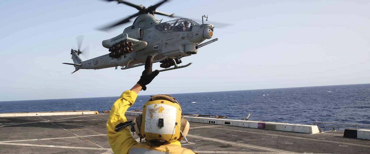 An AH-1Z Cobra helicopter attached to the 15th Marine Expeditionary Unit prepares to land on board the USS San Diego (LPD-22).