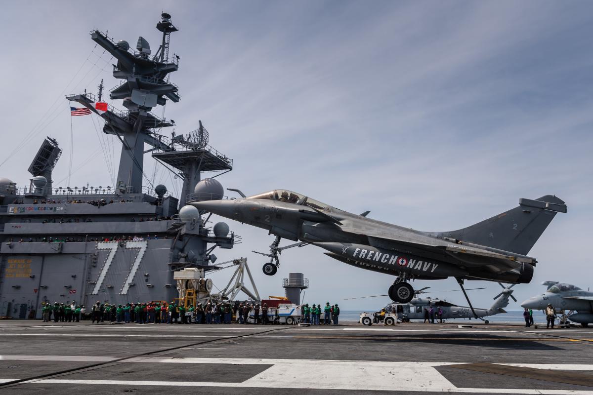 Right side view of a French Rafale-M lands on board the USS George H. W. Bush (CVN-77) at the start of a French squadron’s deployment with Carrier Strike Group Two