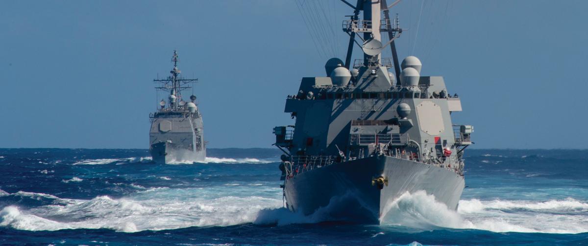 The USS Rafael Peralta (DDG-115), front, and the USS Bunker Hill  (CG-52) in the Pacific Ocean as part of the Theodore Roosevelt  Carrier Strike Group. 