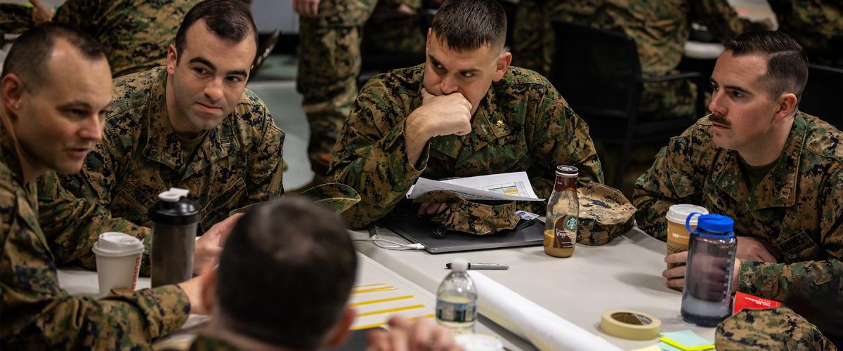 U.S. Marines discuss plans during an annual training period on Marine Corps Base Quantico, Virginia, in March 2023. In recent years, the current officer PME enterprise has been accused of not adequately preparing U.S. military officers for the challenges of the modern operating environment 