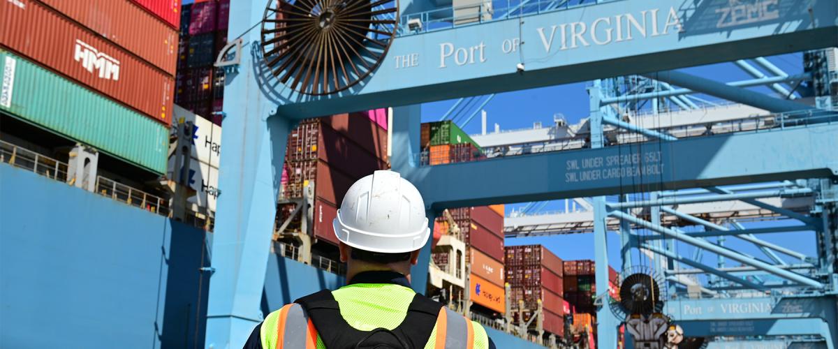A Coast Guard member conducts shipping container inspection training at the Port of Virginia in 2022. The Coast Guard must develop strategic plans of action to shore up cybersecurity norms and best practices for the MTS. 