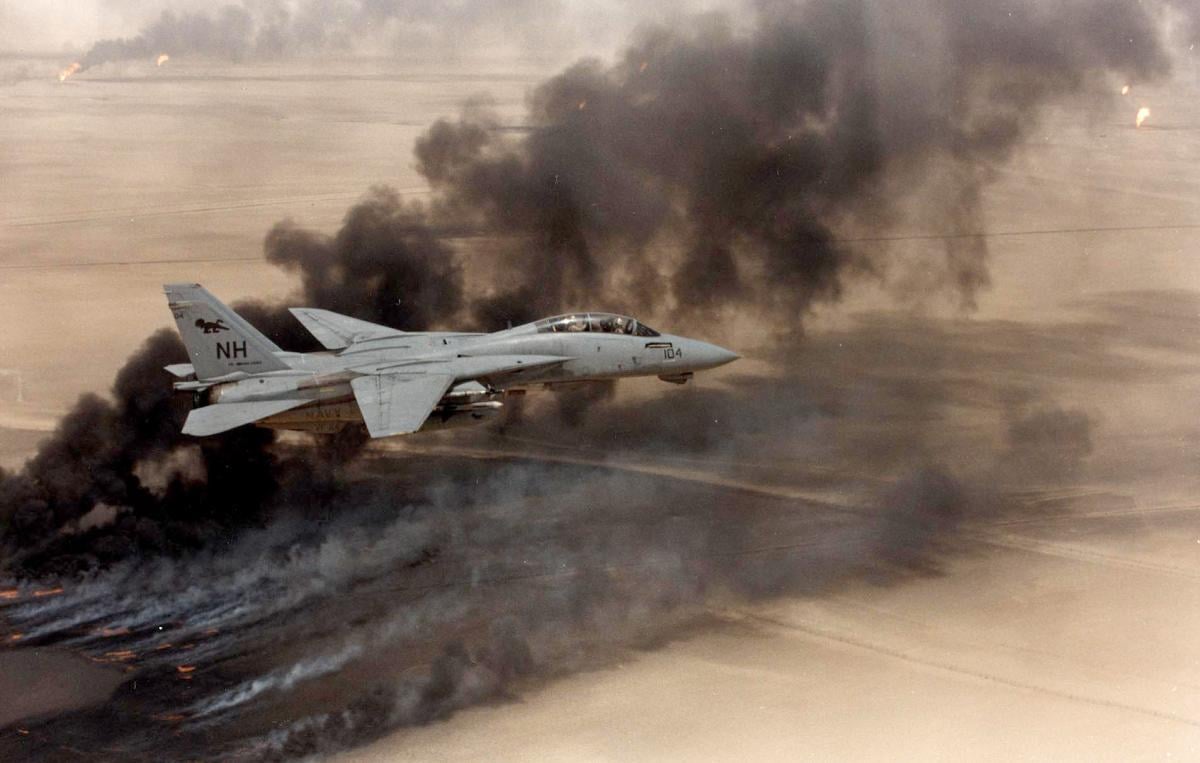 An F-14 Tomcat flies over Kuwait during Operation Desert Storm