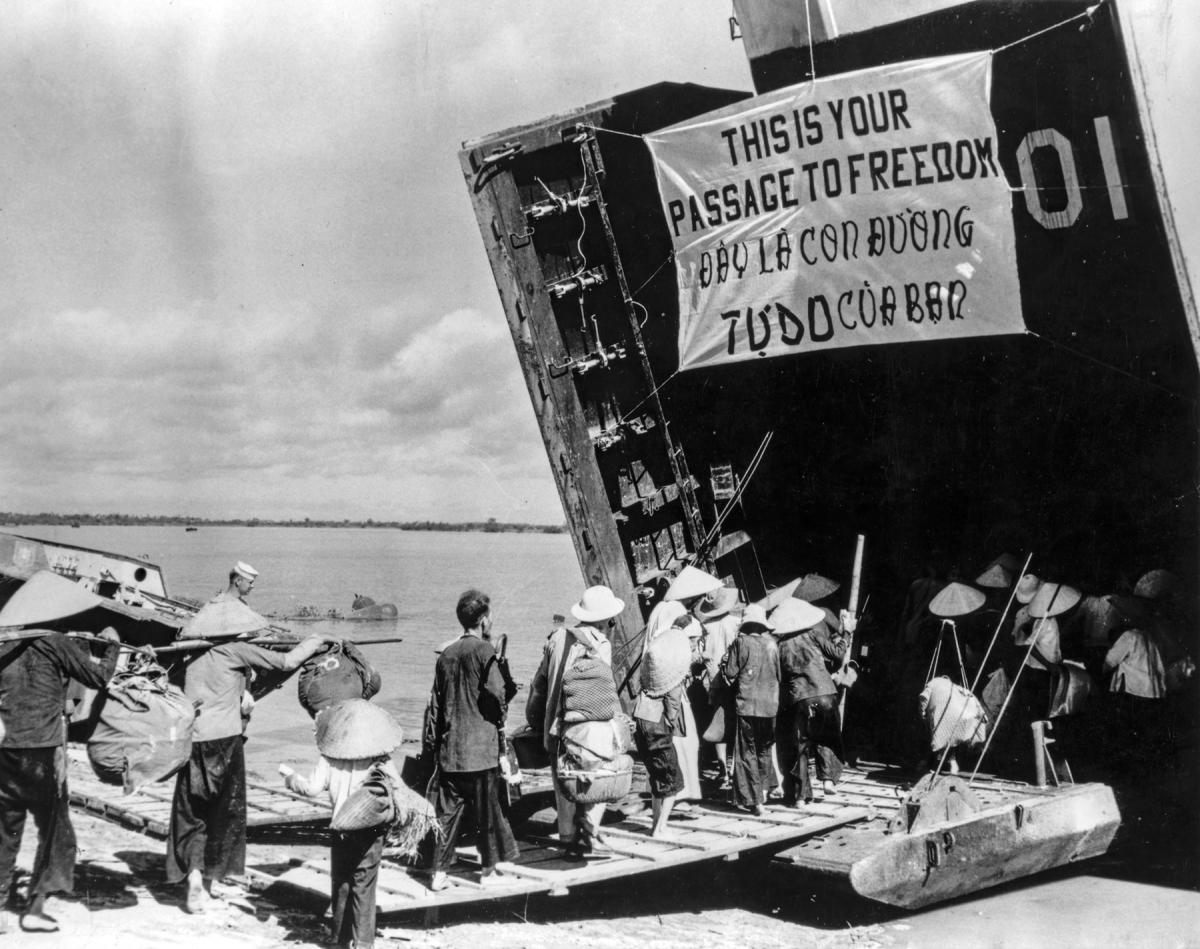 Refugees file onto USS LST-901 during Operation Passage to Freedom.