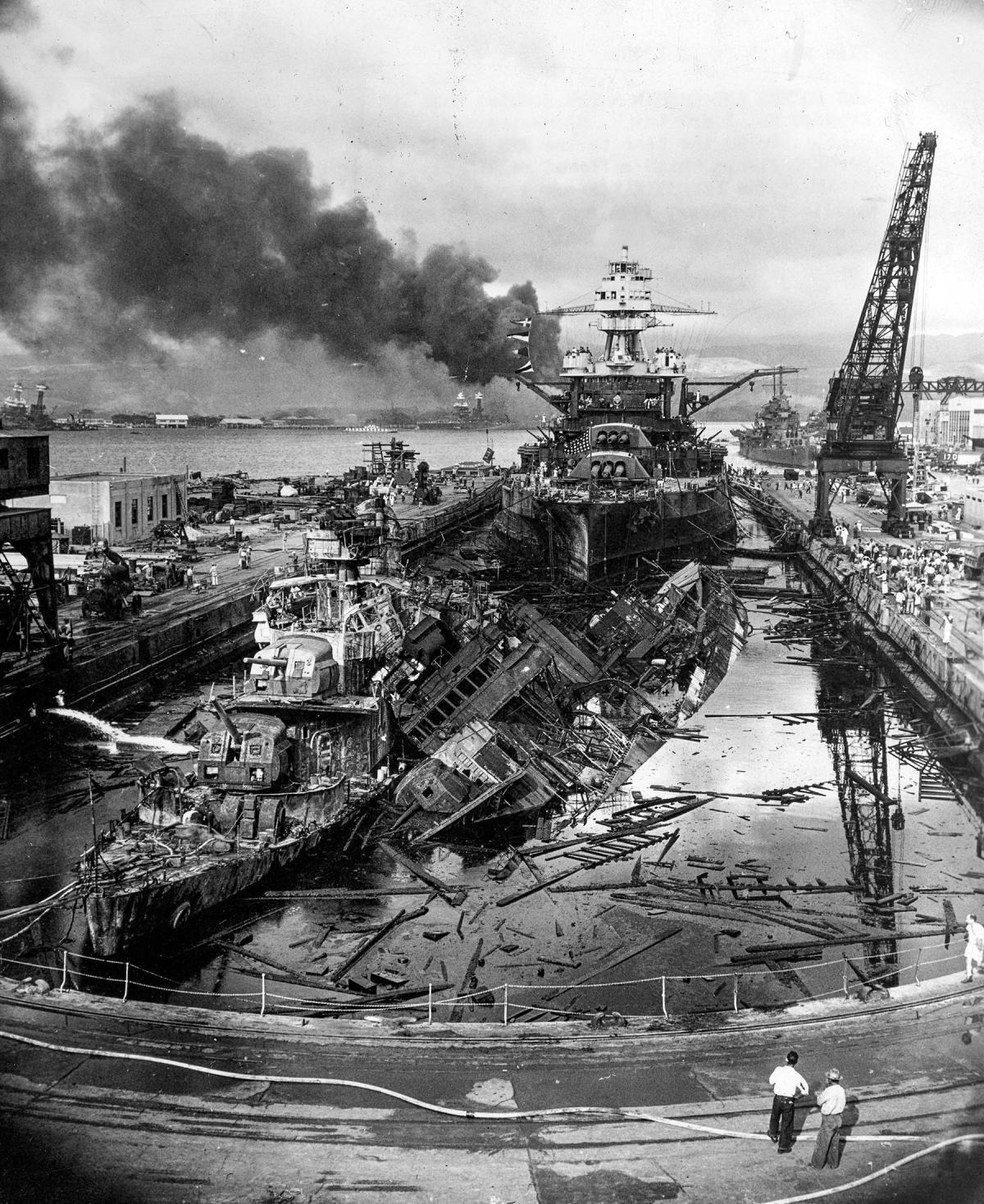 USS Downes (DD-375) and USS Cassin (DD-372) in Drydock One at the Pearl Harbor Navy Yard, soon after the end of the Japanese air attack, 7 December 1941
