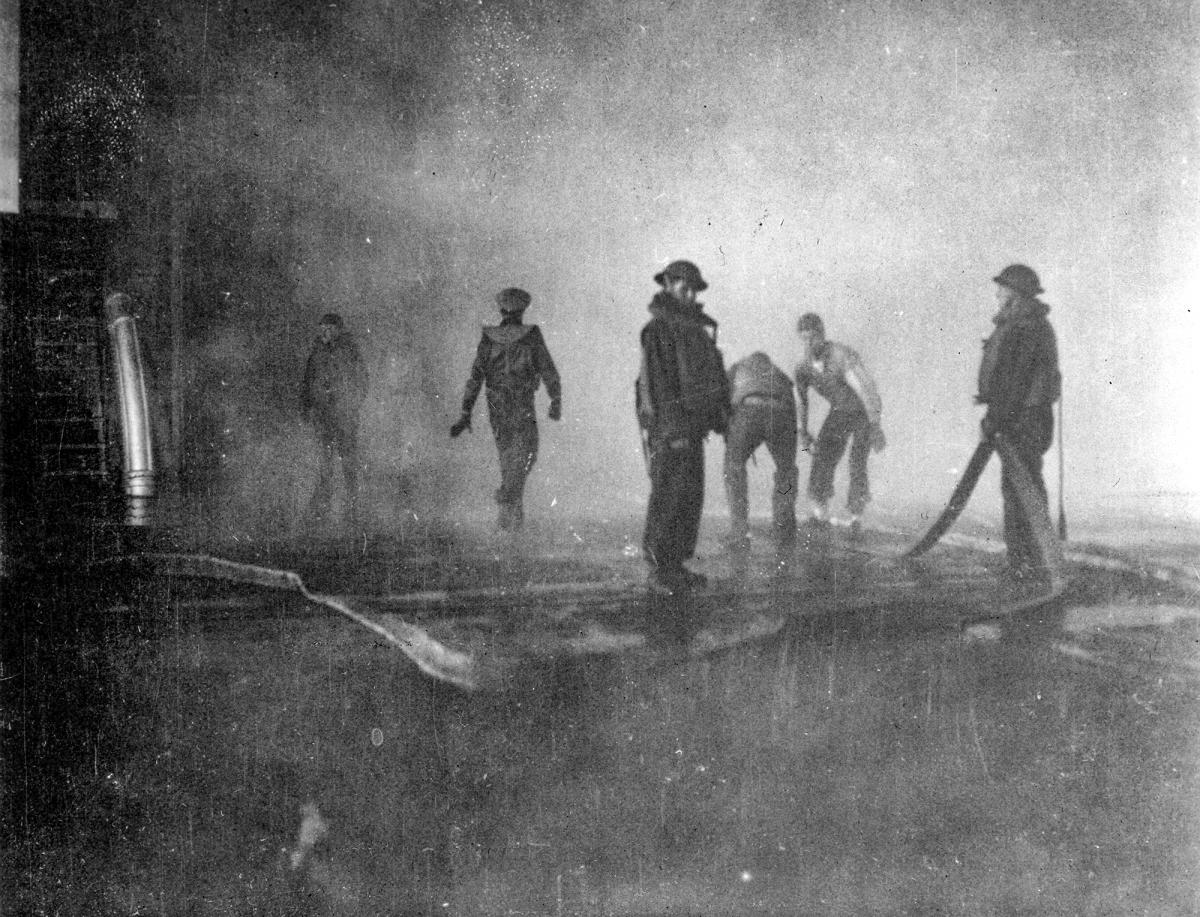Firefighting efforts aboard the stricken USS Yorktown's (CV-5) flight deck