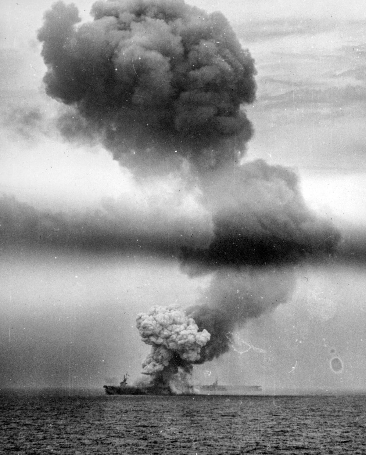 Smoke rising from the USS St. Lo after hits from a kamikazes