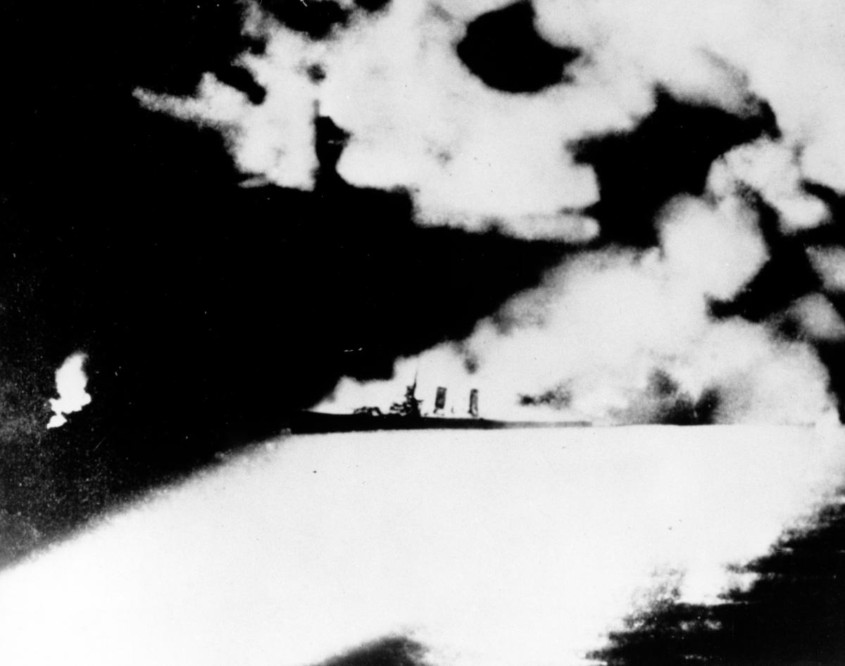 American cruiser caught in the searchlights of a Japanese ship during the Battle of Savo Island