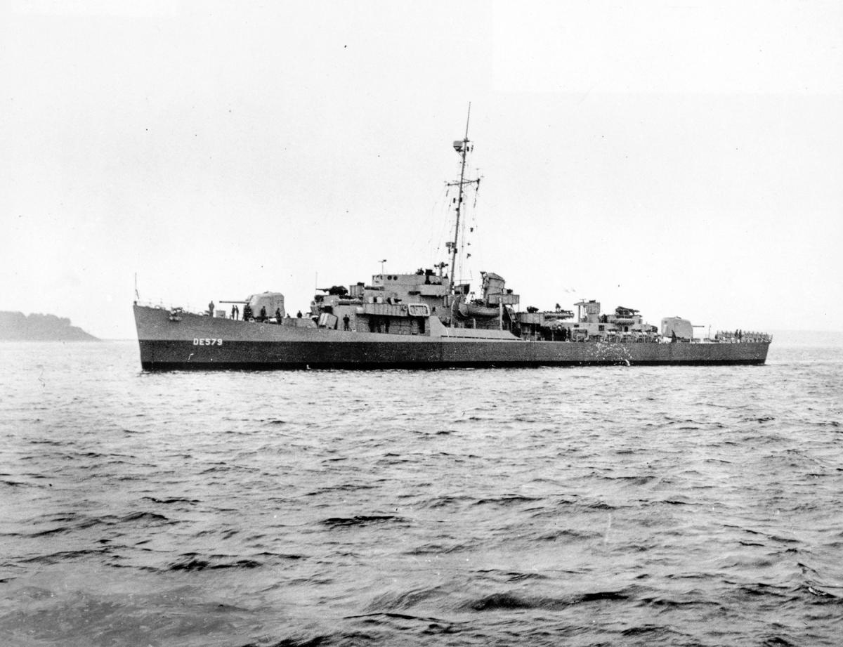 Surface port side view of the USS Riley (DE-579) at rest.
