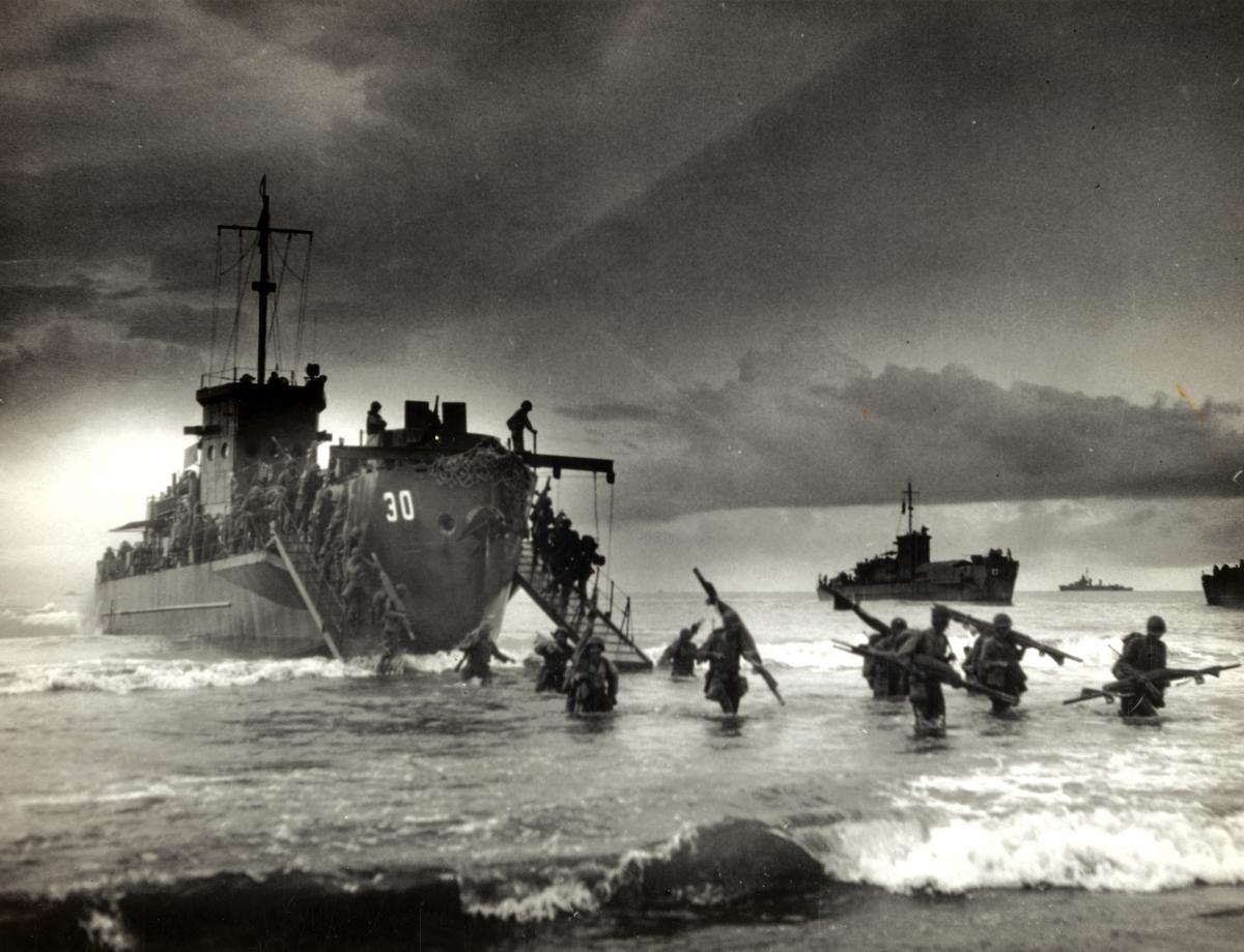Troops from USS LCI(L)-30 reach the beach in the second wave of the invasion of Sarmi, Dutch New Guinea
