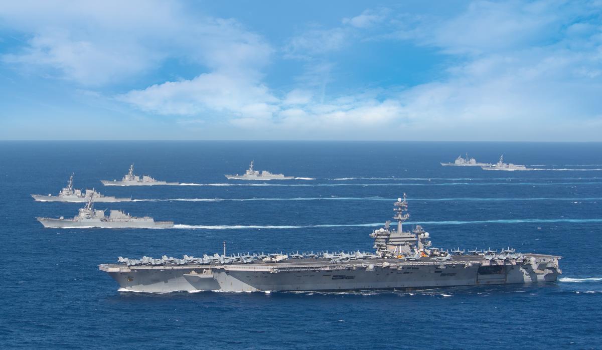 The USS Theodore Roosevelt carrier strike group transits in formation while deployed in the Indo-Pacific region in January 2020. By late March, the carrier would be in Guam battling an outbreak of the COVID-19 illness among the crew. 