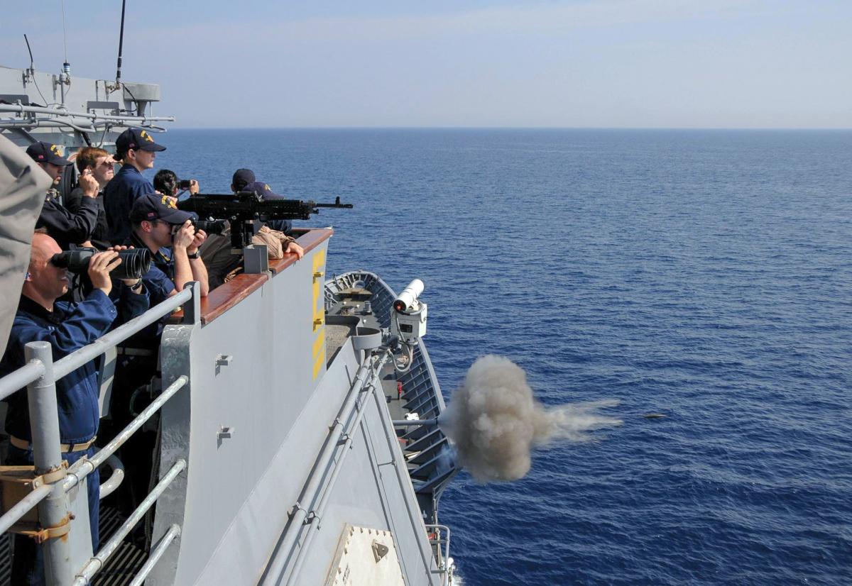Crew members on board the Ticonderoga-class guided-missile cruiser USS Monterey (CG-61) observe as the ship’s weapons department fires the MK-45 5-inch/54-caliber lightweight gun during a gunnery exercise