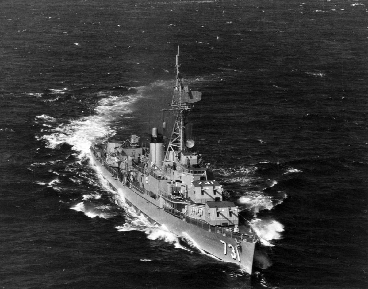 Aerial starboard bow view of the USS Maddox (DD-731) underway.