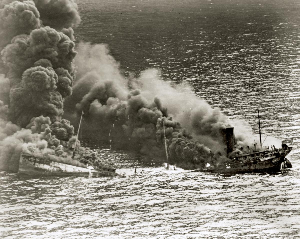 An Allied tanker sinks into the Atlantic after being torpedoed by a U-boat.