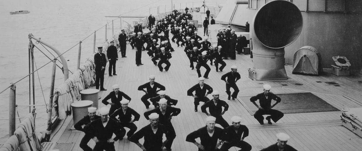 Photograph of sailors undergoing physical fitness training on deck of a ship, date and location unknown.