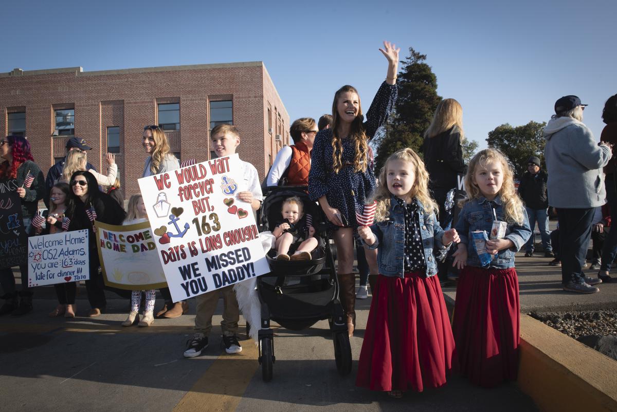 Family members await the return of the U.S. Coast Guard Cutter Stratton 