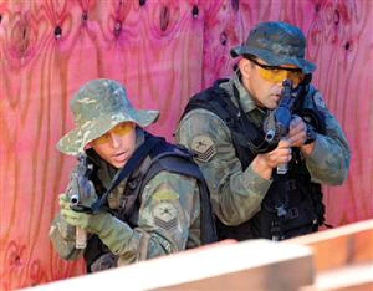 Brazilian marines with Marine Corps Special Operations Battalion (Tonelero) practice close-quarters combat skills during training with U.S. Navy SEALs as part of a joint combined exchange training exercise in Brazil in May. The bilateral training, conduct