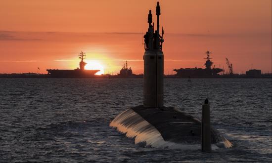 160527-N-N0101-134 USS Washington (SSN-787) underway at sunset