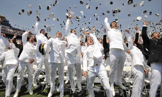 Newly commissioned Navy Ensigns and Marine 2nd Lieutenants from the U.S. Naval Academy Class of 2016 throw their midshipmen covers in the air at the end of their graduation and commissioning ceremony May 27 at the Navy-Marine Corp Memorial Stadium