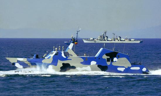 Right surface profile view of a A PLAN Houbei (Type 022)-class fast attack craft underway