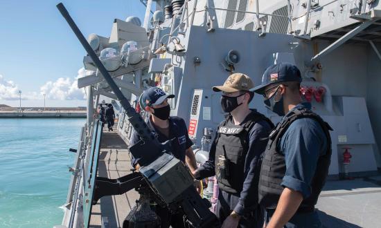Sailors assigned to the Arleigh Burke–class guided-missile destroyer USS Donald Cook (DDG-75) man the .50-caliber machine gun as the ship gets under way from its homeport of Rota, Spain. From August to December 2019, a total of 11 sailors received mental health services through the Naval Hospital Rota secure video teleconference consultation  (VT-Sea) pilot program.