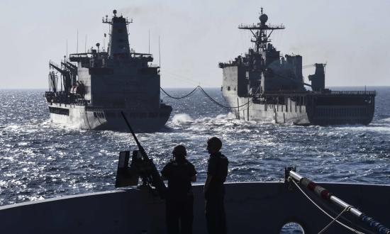 Sailors stand watch on the bow of the USS San Diego.