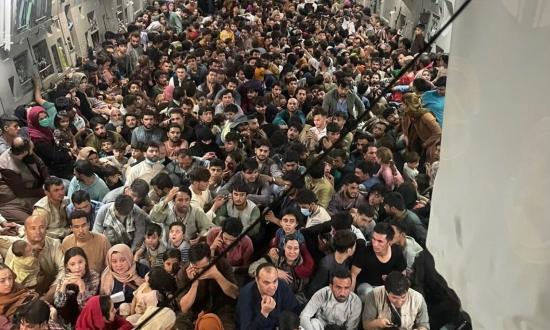 Afghans on USAF C-17 fleeing Kabul