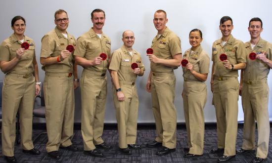 Weapons tactics instructor graduates pose with their patches.