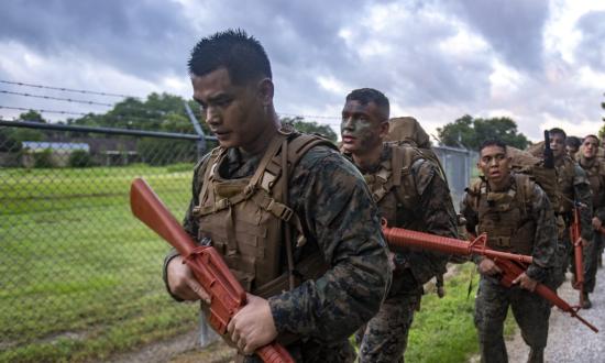 U.S. Marine Corps Reservists hike during a culminating event at Naval Air Station Joint Reserve Base New Orleans on May 23, 2019