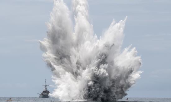 A mine explodes at sea