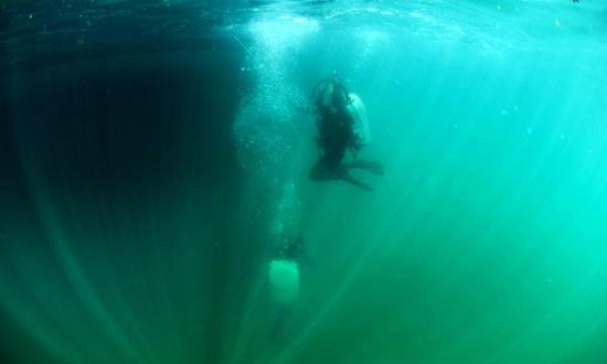 Navy EOD swimmers underwater