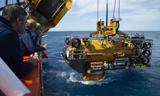 Sailors assigned to the Navy’s Undersea Rescue Command observe as the U.S. Navy Pressurized Rescue Module (PRM) system deploys from the Royal Malaysian Submarine Rescue Ship, MV Mega Bakti, during Exercise Pacific Reach (PACREACH) in 2019. 