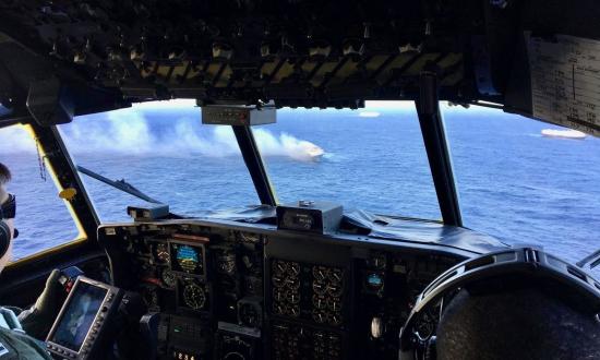 Coast Guard HC-130 flies over the Sincerity Ace in December 2018. 