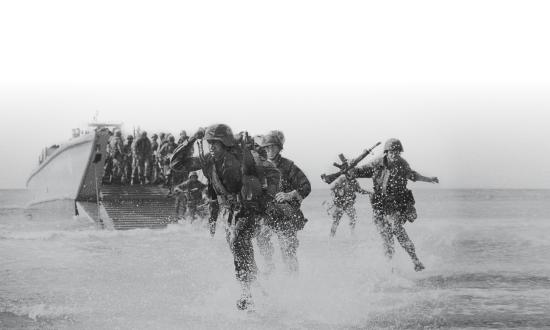 4th Marine Expeditionary Brigade (4th MEB) disembark from an LCM-6 boat while conducting amphibious assaults on Onslow Beach