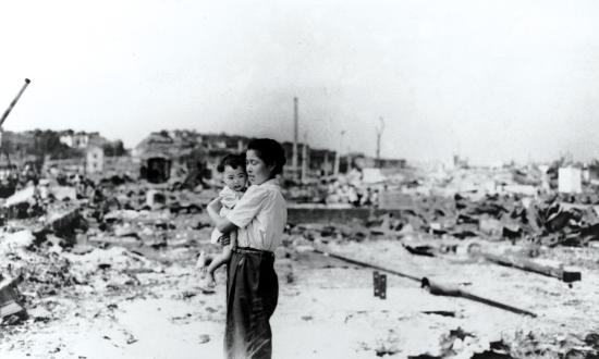 A Japanese woman and child are surrounded by the rubble of a destroyed Tokyo in this September 1945 photo taken by a U.S. sailor. As Quartermaster Michael Bak observed, “We saw nothing but ruins, and how people lived in that ruin is beyond me.”